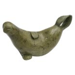 AN INUIT SOAPSTONE CARVING OF A SEAL, it's tail flippers meeting in a pierced arc, the base signed