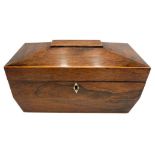 A REGENCY ROSEWOOD TEA CADDY, of sarcophagus form with three division interior, later restored and