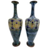 PAIR OF ART NOUVEAU ROYAL DOULTON VASES BY FLORRIE JONES AND E. VIOLET HAYWARD the sides decorated