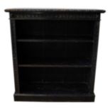 VICTORIAN CARVED OAK OPEN BOOKCASE LATE 19TH CENTURY with three adjustable open shelves, raised on a