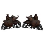 PAIR OF CHINESE CARVED HARDWOOD 'BOY AND BUFFALO' GROUPS QING DYNASTY, 19TH CENTURY the opposing