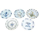 GROUP OF FIVE DUTCH DELFT PLATES 18TH CENTURY each with foliate decoration 22cm diam approx.