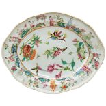 CHINESE EXPORT FAMILLE ROSE CELADON-GROUND OVAL DISH QING DYNASTY, 19TH CENTURY decorated in the