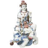 LARGE JAPANESE PORCELAIN FIGURE OF GUANYIN 20TH CENTURY modelled as the Deity seated on a buddhist