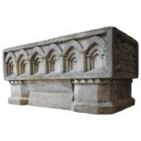 A RECONSTITUTED STONE GARDEN TROUGH, with gothic arch pattern and green man decoration, 37 x 82 x