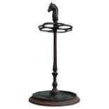A CAST-IRON STICK STAND WITH HORSE HEAD DECORATION
