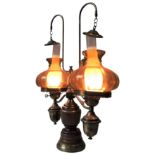 A 20TH CENTURY OAK AND BRASS AMERICAN STYLE DOUBLE STUDENT'S ELECTRIC LAMP, with amber glass shades,