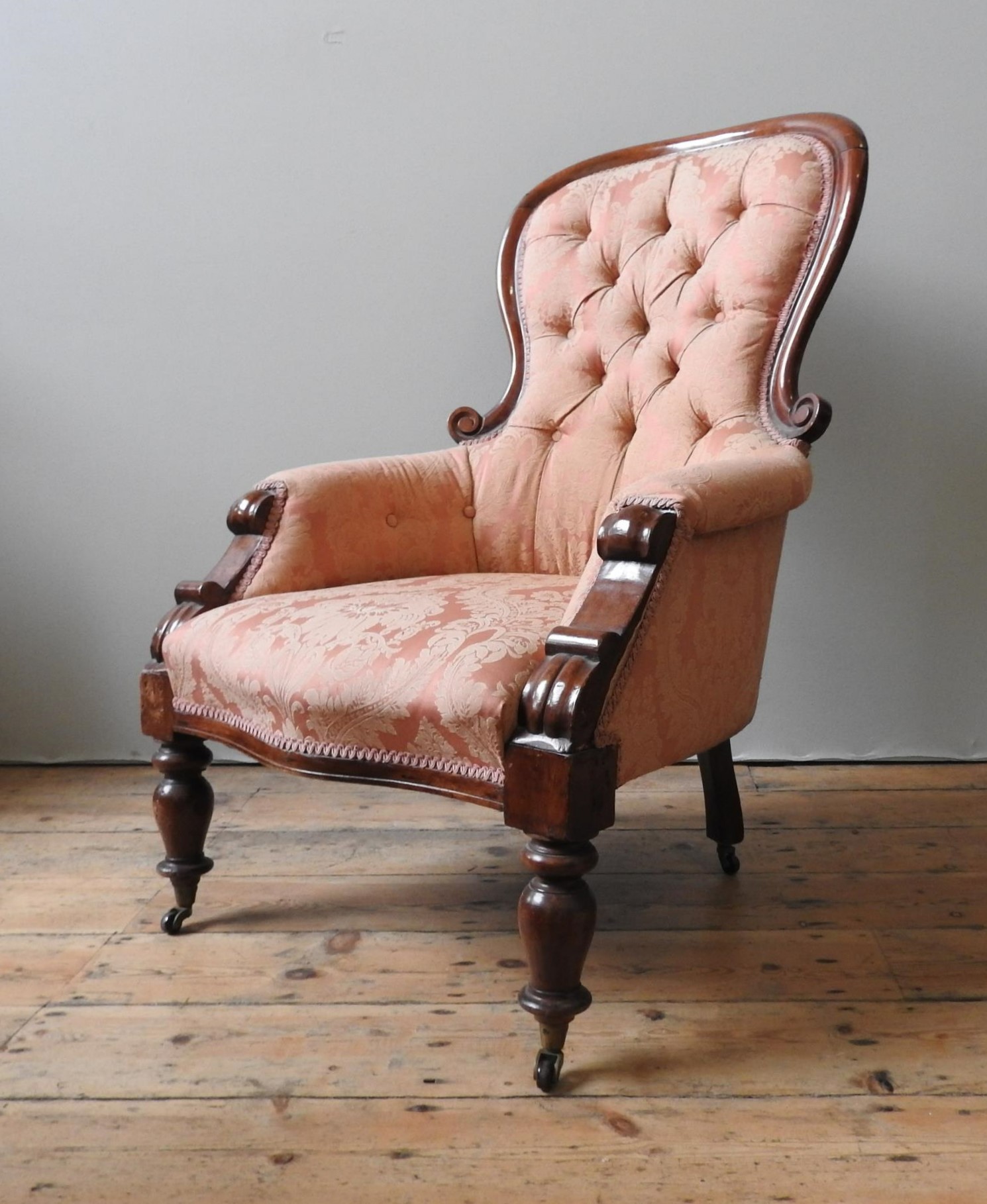 A VICTORIAN MAHOGANY NURSING CHAIR, with scroll carved spoon back, buttoned upholstery supported - Image 2 of 5