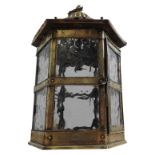 A BRASS AND COPPER OCTAGONAL HANGING LANTERN, with glass panels, turned finials and pierced 'night
