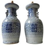 A PAIR OF 19TH CENTURY CHINESE BLUE AND WHITE BALUSTER VASES, drilled and converted to table