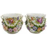 PAIR OF CONTINENTAL PORCELAIN CACHE POTS CIRCA 1900 the sides painted with floral bouquets and