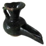 A PERSIAN GREEN GLAZED CERAMIC OIL LAMP, 9cm high x 12cm long