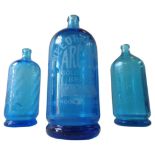 THREE 19TH CENTURY BLUE GLASS SODA BOTTLES, all with etched lettering and design, two English