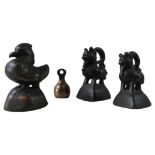THREE ASHANTI BRONZE OPIUM OR GOLD WEIGHTS in the form of a duck and two stylised creatures, 7cm max