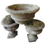 A PAIR OF WEATHERED RECONSTITUTED STONE GARDEN PLANTERS AND TAPERED WEATHERED PLANTER, the pair of