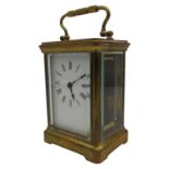 AN EARLY 20TH CENTURY ENGLISH BRASS CARRIAGE CLOCK, 11cm high, with winding key, in working order