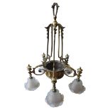 AN EDWARDIAN BRASS FIVE-BRANCH CENTRE LIGHT, the curved cage with five supports over a tied-