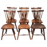 A SET OF SIX ENGLISH OAK 18TH CENTURY TAPERED SPINDLE BACK WINDSOR CHAIRS, with sculpted seats in