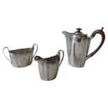 A THREE PIECE SILVER COFFEE SET, London 1934. Tessier Ltd (Vanderbilts & Hedges mark). 26.1oz