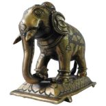 INDIAN COPPER ALLOY FIGURE OF AN ELEPHANT, probably 19th century, with chiselled decoration and upon