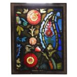 A 19th CENTURY STAINED GLASS PANEL IN ARTS AND CRAFTS STYLE, decorated with flower heads and a '