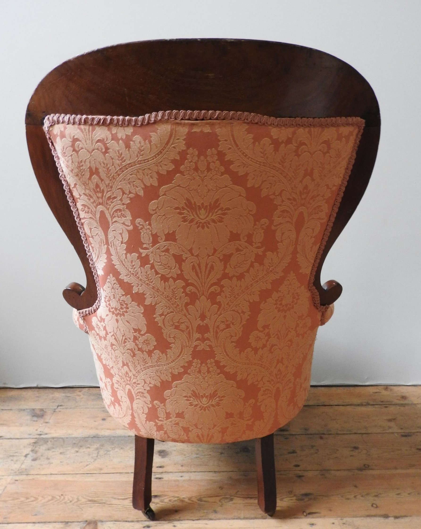 A VICTORIAN MAHOGANY NURSING CHAIR, with scroll carved spoon back, buttoned upholstery supported - Image 5 of 5