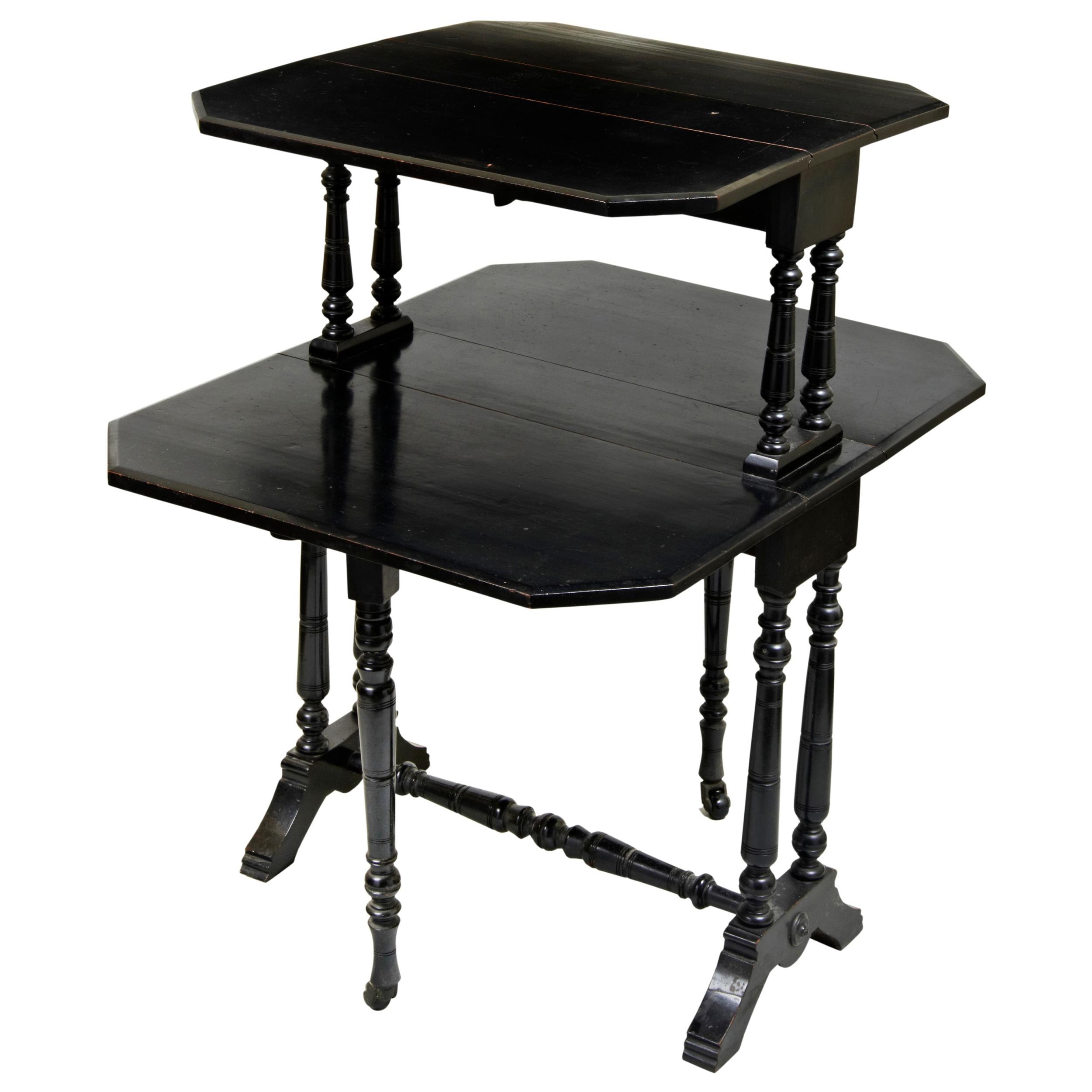 VICTORIAN EBONISED 'AESTHETIC' TWO TIER SUTHERLAND TABLE, CIRCA 1880, the graduated rectangular drop