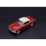 1953 STUDEBAKER COMMANDER STARLINER BY DANBURY MINT Finished in Bombay Red and Salem White.