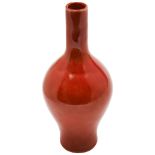 CORAL-RED BALUSTER VASE LATE QING DYNASTY covered in a a mottled rich coral-red glaze, apocryphal