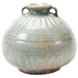 CELADON-GLAZED JAR SONG DYNASTY (960-1279) the squat baluster sides carved with a band vertical