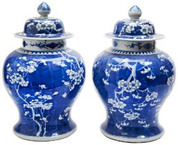 LARGE PAIR OF BLUE AND WHITE 'PRUNUS AND CRACKED-ICE' COVERED JARS QING DYNASTY, 19TH CENTURY with