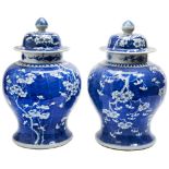 LARGE PAIR OF BLUE AND WHITE 'PRUNUS AND CRACKED-ICE' COVERED JARS QING DYNASTY, 19TH CENTURY with