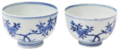 TWO BLUE AND WHITE 'PRUNUS' BOWLS QING DYNASTY, 18TH / 19TH CENTURY the sides painted in tones of