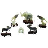 GROUP OF SIX CARVED GREEN HARDSTONE FIGURES LATE QING / REPUBLIC PERIOD comprising an elephant on