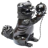 LARGE BRONZE BUDDHIST LION CENSER AND COVER 17TH CENTURY the ferocious beast seated with head turned