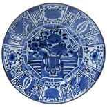 BLUE AND WHITE 'KRAAK' STYLE DISH QING DYNASTY, 19TH CENTURY painted with various vegetations and