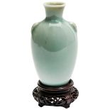 SMALL CELADON VASE QING DYNASTY, 19TH CENTURY of baluster form, raised on a carved hardwood stand