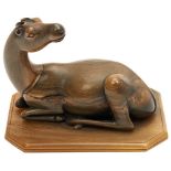 CARVED BUFFALO HORN FIGURE OF A DEER QING DYNASTY, 19TH CENTURY  modelled recumbent with its head