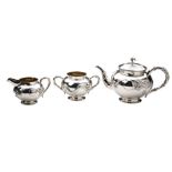 CHINESE SILVER THREE PIECE TEA SET TSUN TSUN, LATE QING DYNASTY of globular form the sides with