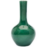 GREEN-GLAZED BOTTLE VASE QING DYNASTY, 18TH CENTURY the sides covered all over on a rich apple-green