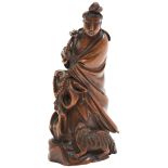 BAMBOO CARVED FIGURE OF GUANYIN QING DYNASTY, 18TH / 19TH CENTURY modelled standing in a long