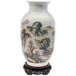 FAMILLE VERTE 'LANDSCAPE' VASE 20TH CENTURY the sides painted with a continuous mountain