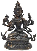 GILT BRONZE FIGURE OF OF A SIX-ARMED BODHISATTVA TIBET, 19TH CENTURY cast with a contemplative