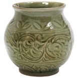 CELADON YAOZHOU-TYPE JAR YUAN OR JIN DYNASTY the sides finely carved with a wide band of scrolling