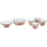 GROUP OF SIX IRON-RED TEA WARES QING DYNASTY, 19TH CENTURY comprising four tea bowls, a low bowl and