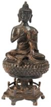GILT-BRONZE FIGURE OF SHAKYAMUNI  MING DYNASTY, 16TH / 17TH CENTURY seated on a lotus throne 30cm
