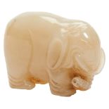 SMALL CARVED YELLOW JADE ELEPHANT QING DYNASTY, 18TH / 19TH CENTURY modelled as the beast standing