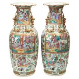 LARGE PAIR OF FAMILLE ROSE CANTON VASES QING DYNASTY, 19TH CENTURY the baluster sides painted with