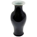 MIRROR-BLACK GLAZED BALUSTER VASE QING DYNASTY, 19TH CENTURY the sides covered in a thick black-