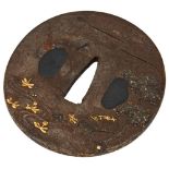 JAPANESE IRON AND MIXED METAL TSUBA EDO PERIOD decorated in relief with a bridge and a straw hut